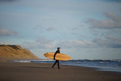 Dr Scura with surfboard